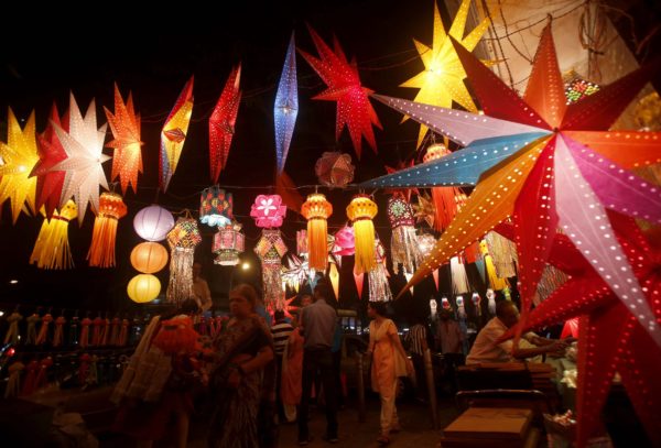 Indians buy lanterns from roadside stalls ahead of Hindu festival of lights Diwali, in Mumbai, India, Sunday, Oct. 27, 2013. Lanterns are a popular traditional decoration as people decorate their homes during the Diwali festival. (AP Photo/Rafiq Maqbool)